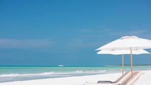 On the beach, beach cabanas, sun-loungers, beach umbrellas