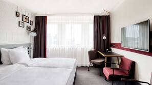 Luxe beddengoed, een minibar met enkele gratis items