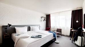 Luxe beddengoed, een minibar met enkele gratis items