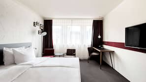 Luxe beddengoed, een minibar met enkele gratis items