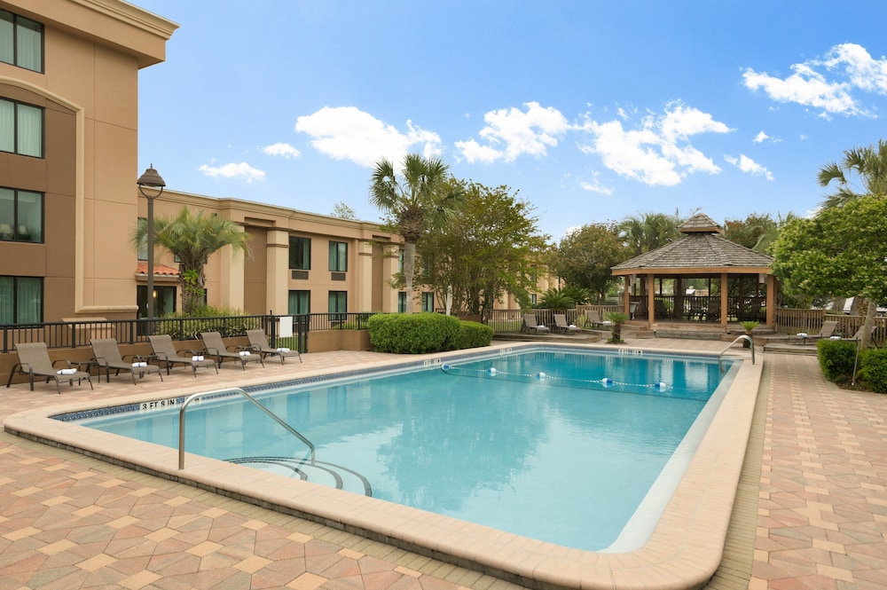 Outdoor pool, Ramada by Wyndham Jacksonville I-95 by Butler Blvd