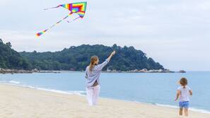 On the beach, beach towels, beach volleyball, beach bar