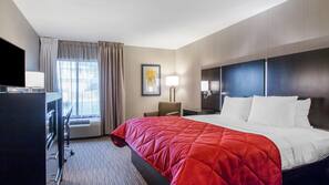Premium bedding, desk, laptop workspace, blackout drapes