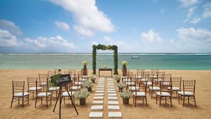 Beach nearby, white sand, beach umbrellas, beach towels
