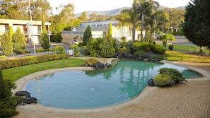 Outdoor pool, open 9 AM to 9 PM, pool loungers
