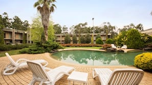 Outdoor pool, open 9 AM to 9 PM, pool loungers