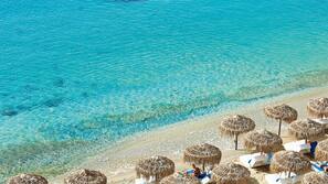 On the beach, sun loungers, beach umbrellas, beach towels