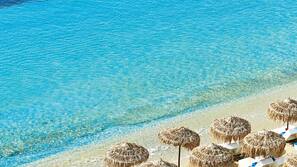 On the beach, sun loungers, beach umbrellas, beach towels