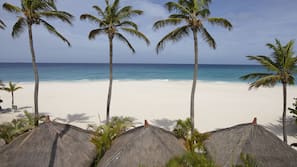 On the beach, white sand, free beach cabanas, sun loungers