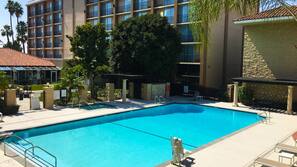 Outdoor pool, open 7:00 AM to 10:00 PM, sun loungers