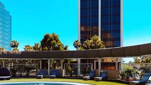 Outdoor pool, open 9:00 AM to 9:00 PM, free cabanas, pool umbrellas