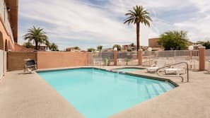 Outdoor pool, open 9:00 AM to 10:00 PM, pool loungers