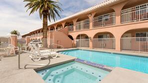 Outdoor pool, open 9:00 AM to 10:00 PM, pool loungers