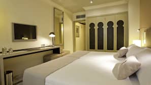 Ropa de cama de alta calidad, minibar, caja fuerte y escritorio