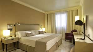 Ropa de cama de alta calidad, minibar, caja fuerte y escritorio