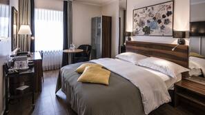 Hypo-allergenic bedding, down comforters, minibar, in-room safe