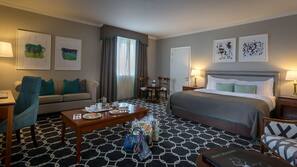 Premium bedding, desk, laptop workspace, blackout drapes