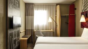 Desk, blackout curtains, iron/ironing board, rollaway beds
