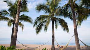 On the beach, sun loungers, beach umbrellas, beach towels