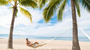On the beach, sun loungers, beach umbrellas, beach towels