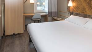 Luxe beddengoed, een kluis op de kamer, een bureau