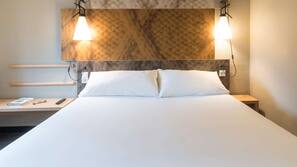 Luxe beddengoed, een kluis op de kamer, een bureau