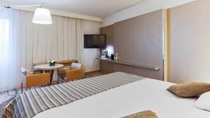 Premium bedding, free minibar items, in-room safe, desk