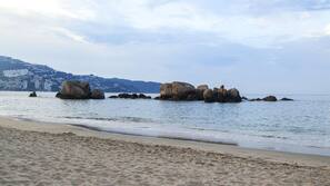 On the beach, sun loungers, beach umbrellas, beach towels