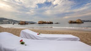 On the beach, sun loungers, beach umbrellas, beach towels