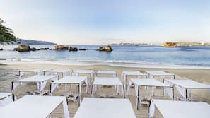 On the beach, sun loungers, beach umbrellas, beach towels