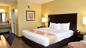 Premium bedding, desk, laptop workspace, blackout curtains