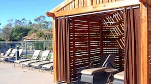 Outdoor pool, open 6 AM to 11 PM, cabanas (surcharge), pool umbrellas