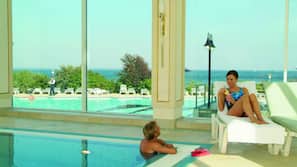 Indoor pool, outdoor pool, pool umbrellas