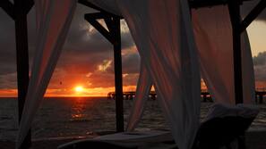 On the beach, sun loungers, beach towels