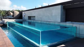 Seasonal outdoor pool, pool loungers