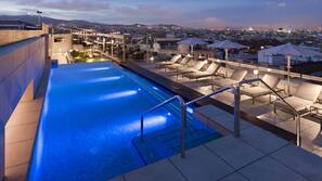Seasonal outdoor pool, pool loungers