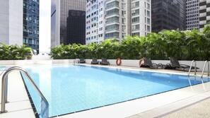 Outdoor pool, open 10:00 AM to 7:00 PM, pool umbrellas