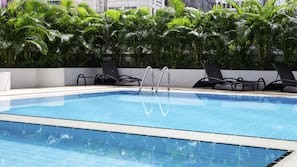 Outdoor pool, open 10:00 AM to 7:00 PM, pool umbrellas