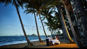 On the beach, sun-loungers, beach towels, beach yoga