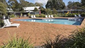 Seasonal outdoor pool, open 6:00 AM to 10:00 PM, pool loungers
