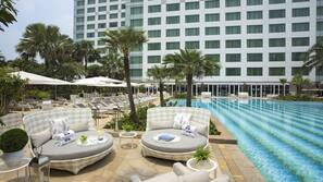 Outdoor pool, open 6:00 AM to 8:00 PM, pool umbrellas, pool loungers