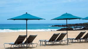 On the beach, sun-loungers, beach umbrellas, beach towels
