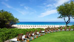 On the beach, sun-loungers, beach umbrellas, beach towels