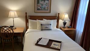 Hypo-allergenic bedding, desk, laptop workspace, blackout curtains