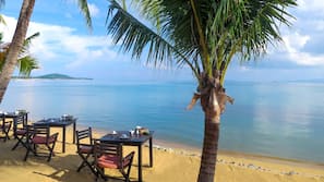 On the beach, sun-loungers, beach umbrellas, beach towels