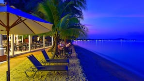On the beach, sun-loungers, beach umbrellas, beach towels