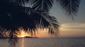 On the beach, sun-loungers, beach umbrellas, beach towels