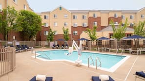 Seasonal outdoor pool, open 9:00 AM to 10:00 PM, pool umbrellas