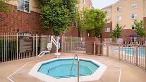 Seasonal outdoor pool, open 9:00 AM to 10:00 PM, pool umbrellas