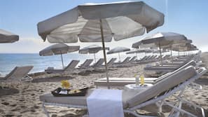 On the beach, beach cabanas, sun-loungers, beach umbrellas